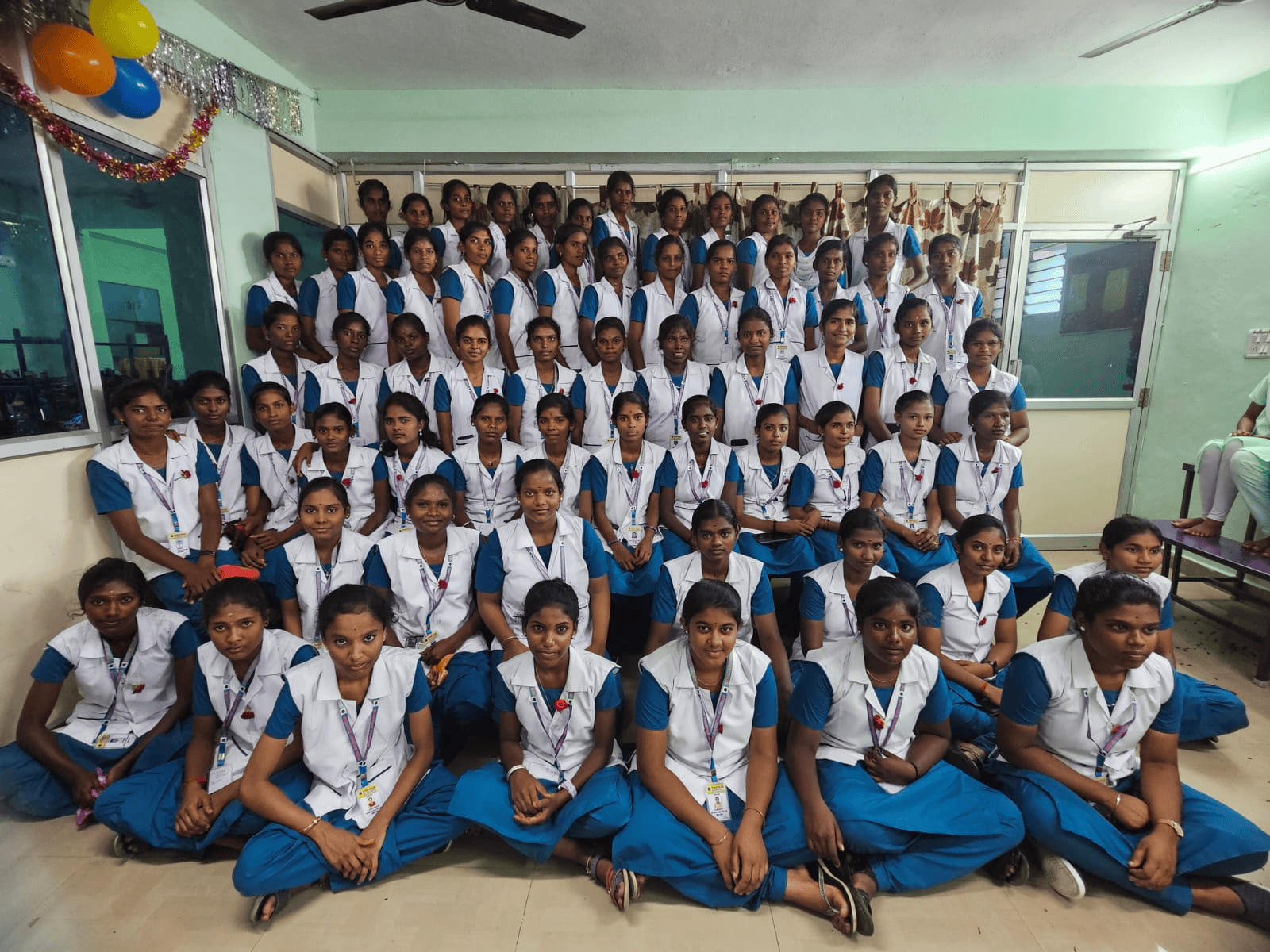 Vinayaga nursing college batch photo – students in blue and white uniforms with balloons in background