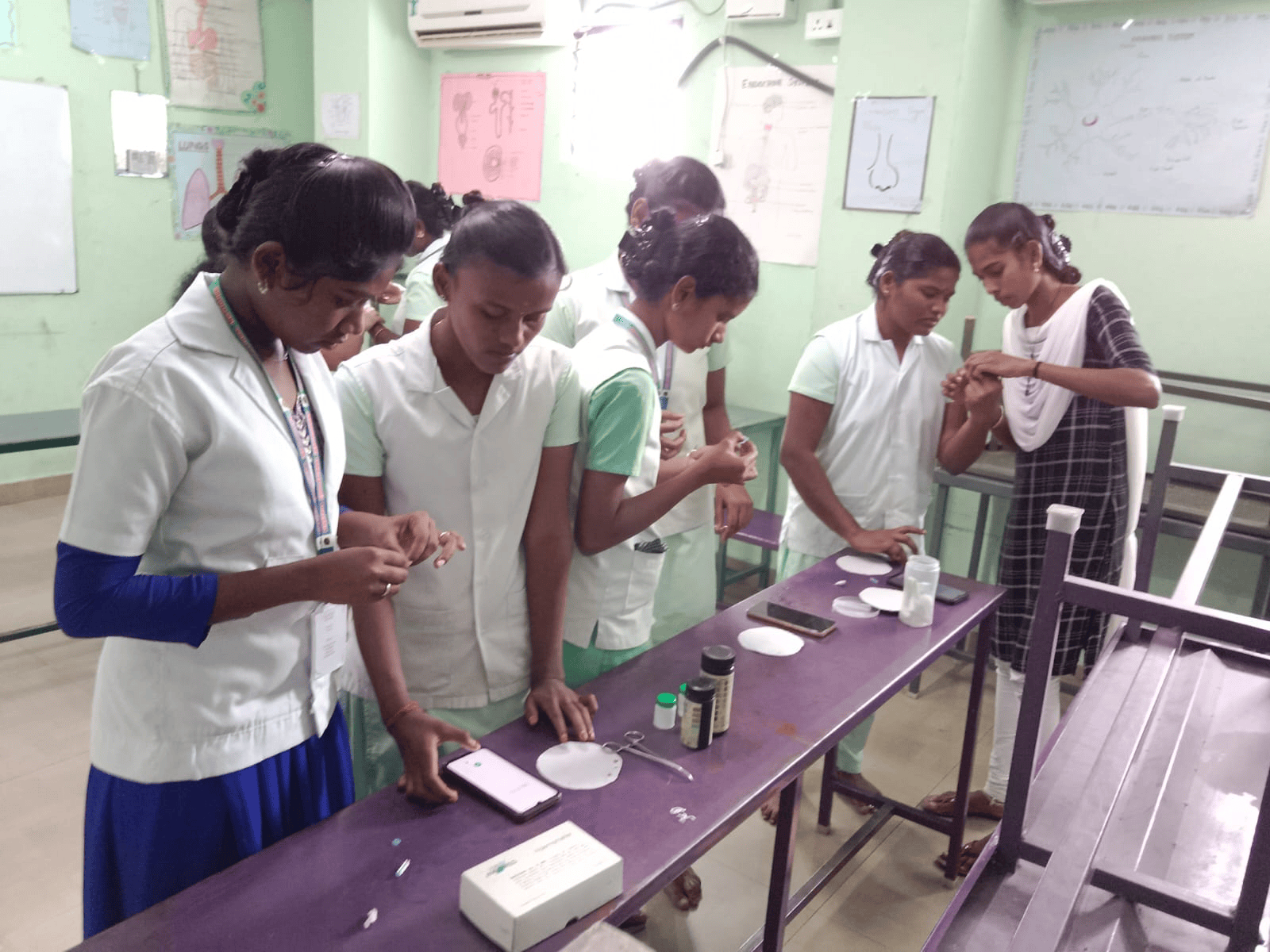 Vinayaga nursing students practising wound dressing and patient care procedures in the nursing skills laboratory